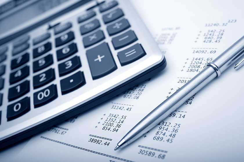 paper receipt with a calculator and pen on top of it