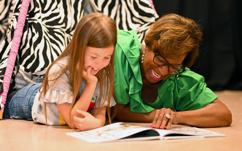 Early education teacher working with a pre-school girl