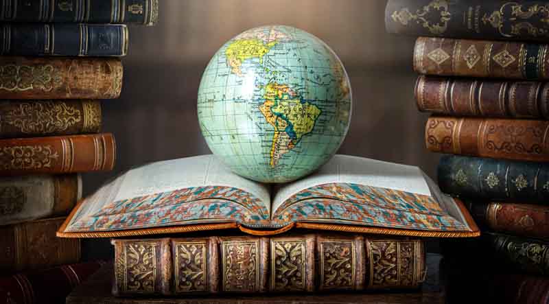 Globe sitting on top of an open book